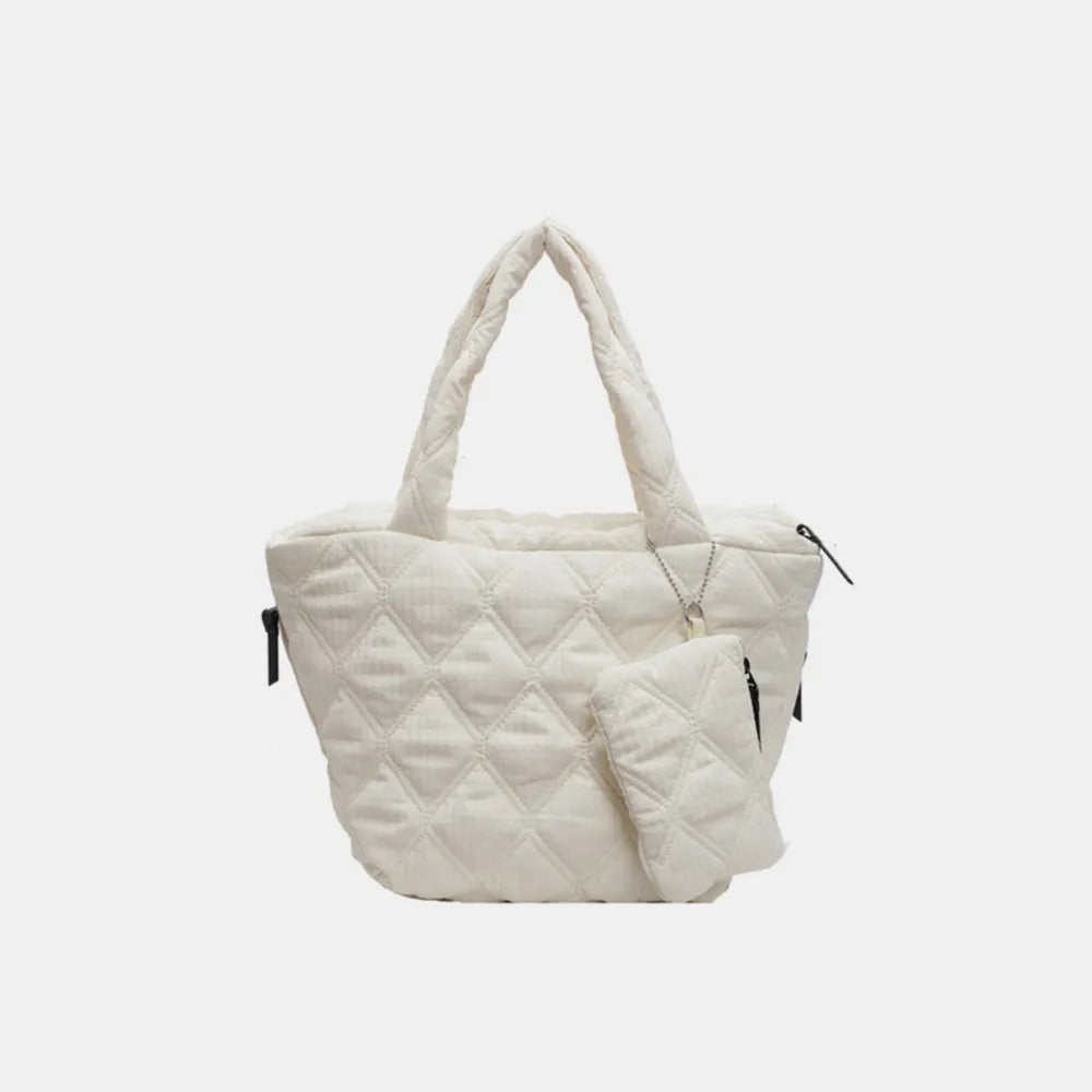 Braune gesteppte Handtasche mit gepolsterten Griffen und kleiner abnehmbarer Mini-Tasche als Anhänger